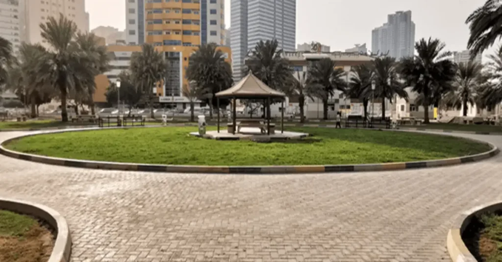 Entrance of Nahda Park Riyadh with green lawns and walking paths