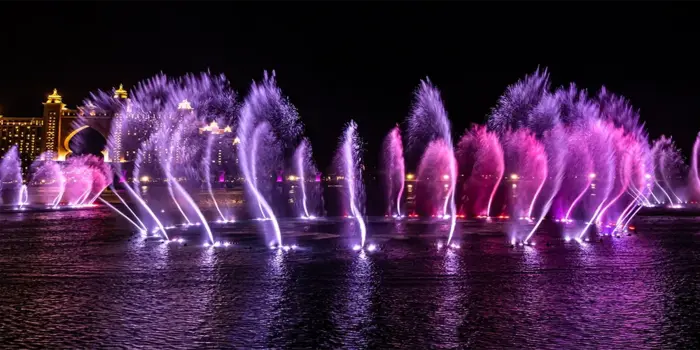 Dubai skyline at night with lights, activities, and entertainment for visitors