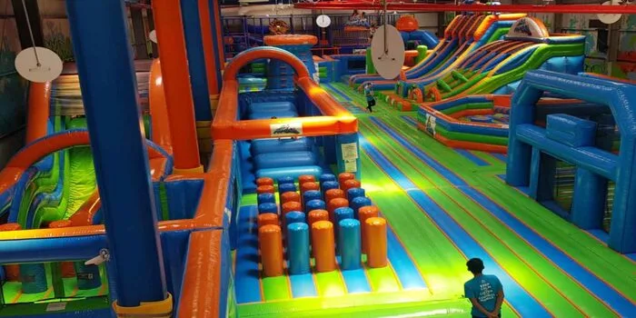 Action Park Dubai with people enjoying adventure activities and obstacle courses