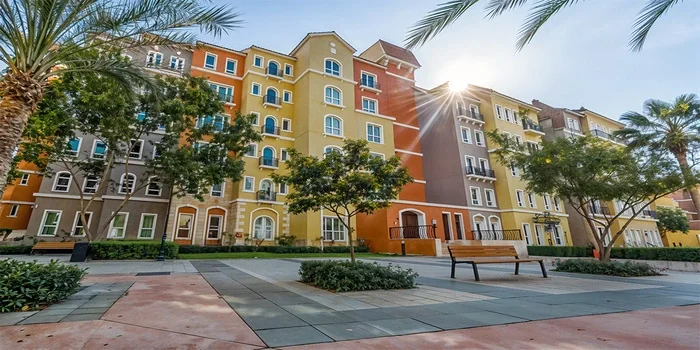 Discovery Gardens Dubai residential community showing landscaped gardens, apartments, and walking paths