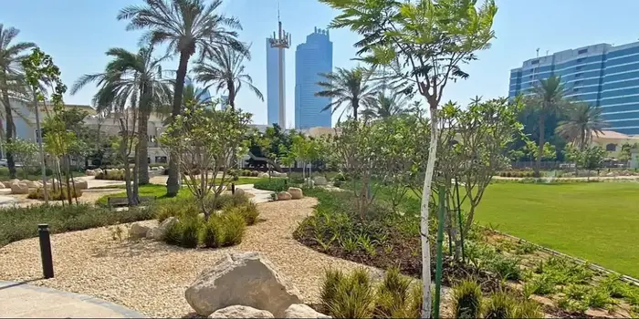 Sheikha Fatima Park in Abu Dhabi showing green lawns, play zones, and family-friendly spaces