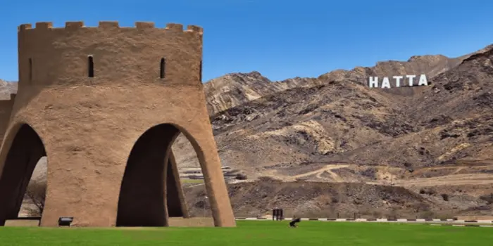 Scenic view of Hatta mountains, lake, and outdoor activities in UAE